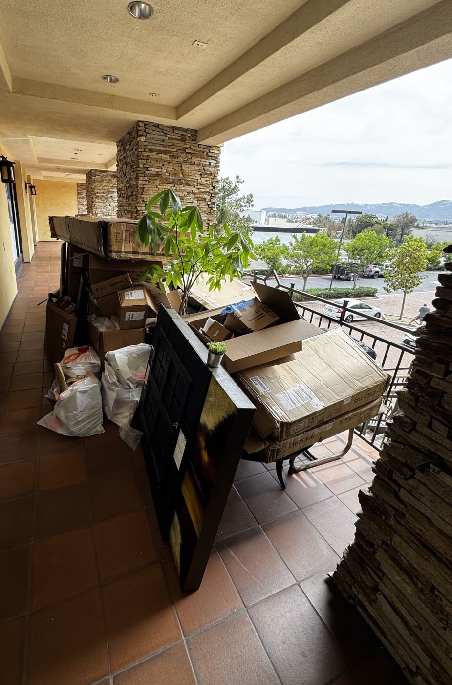 Office balcony stacked with boxes before cleanout